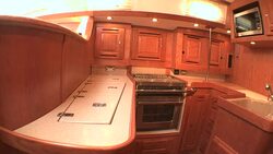Cupboards provide storage in the galley of a Tartan Yacht. Stock Footage