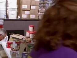 September 2005  Medium shot pan volunteers sorting cans and packing boxes at Hurricane Katrina relief center / Mississippi Stock Footage