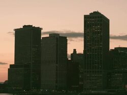MS PAN TWILIGHT New York Harbor from glass office buildings to Statue of Liberty PART 2 of 2/ New York, New York, USA Stock Footage