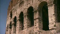 Holes caused by erosion cover the exterior of the Colosseum in Rome, Italy. Stock Footage