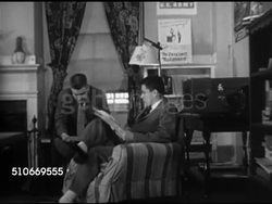 1951: HARVARD UNIVERSITY DORMS: Students in dorm House common room, VS Students reading, at piano, checkers. DRAMATIZATION: Roommates talking, SOT saying brother made Phi Del, other saying 'House' system beats Fraternities, get to know more people. Instructional Video