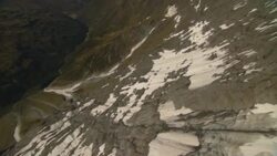 Snow dusts the slope of a glacier. Stock Footage