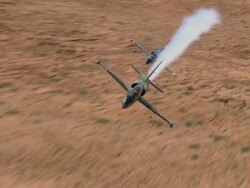 AIR TO AIR, CU, Two Aero L-39 Albatroses flying over rock formations, Grand Canyon, Arizona, USA Stock Footage