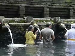 MS PAN Balinese take bath in Holy spring of Pura Tirta Empul / Tampaksiring, Bali, Indonesia Stock Footage