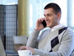 Young man with phone and laptop Stock Footage