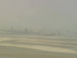 WS AERIAL PAN View of city and highway in desert / Qatar Stock Footage