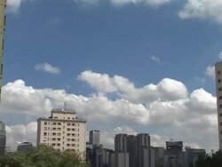 T/L, MS, Brazil, Sao Paulo, White clouds over buildings Stock Footage