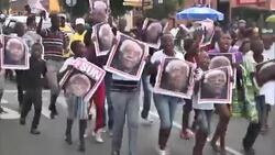 Mourners gather outside Mandela's former home and pay tribute in song and dance News Clip