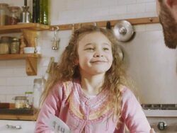 CU Shot of daughters face as she gets ingredients that recipe by daddy / London, United Kingdom  Stock Footage
