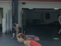 Medium profile. Jean Anne performs series of dumbell snatches. Stock Footage