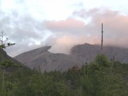 Wide shot of steam rising from volcanic crater at dawn, Japan Stock Footage