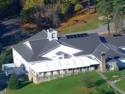 MS AERIAL ZO Shot of Norman Rockwell Museum near river / Massachusetts, United States Stock Footage