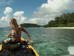 Woman traveling by boat along Indonesian fishermen's Island Stock Footage