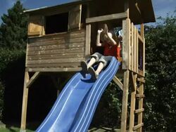 Kids sliding (Shot on Red) Stock Footage