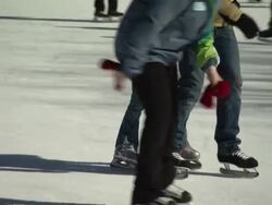 MS TS Shot of Ice skaters at Place You Ville / Quebec, Canada Stock Footage
