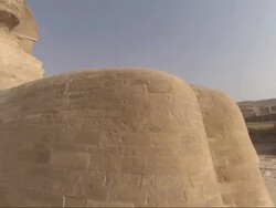 Medium, crane - The Sphinx stands majestically in the desert / Egypt Stock Footage