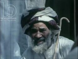 Nizwa fort and guards. Traders in the marketplace and surveys about telecommunications. UAE, 1974. Stock Footage