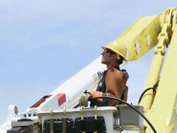 MS TU Man in Safety Gear Raising Bucket Truck to Access Electrical Transformer Box / Oyster, Virginia, USA Stock Footage