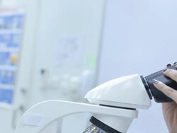 HD : Scientist Couple using microscope Stock Footage