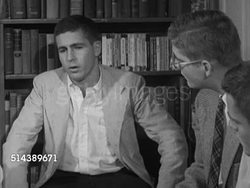 1953: YALE UNIVERSITY BULL SESSION: VS 'William College' building. INT VS Students, including Warren Zimmerman, gathered around talking about politics, communism, government investigations, communist teachers, students (SOT). Student debate Instructional Video