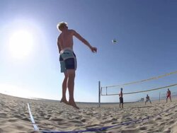 Men playing beach volleyball. Stock Footage