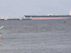 Colorful fishing boat with tanker Stock Footage