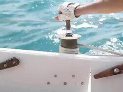 Yachtsman sails controls Stock Footage