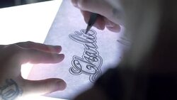 Tattoo Artist Sketching Handheld Shot Stock Footage
