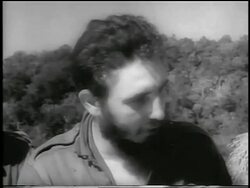 B/W 1959 close up Fidel Castro looking down + to side + talking / Cuba / newsreel Stock Footage