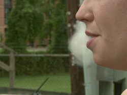 Woman lights up and smokes cigarette Stock Footage