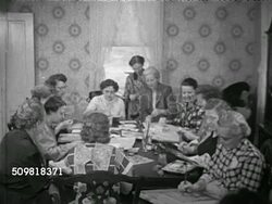 1952: PAINTING GROUP: HA TD WS Baltimore Women's Club meeting, carrying sketchbooks walking down sidewalk, knocking on Cornwell house door, going inside. VS Women sitting at dining room table painting, Mrs. Kent helping, MS Flowers in pot painting. Instructional Video