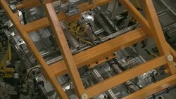 Automated machines lift and move auto body parts. Stock Footage