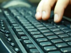 Writing on computer keyboard Stock Footage