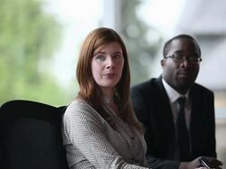 MS businesswoman in discussion with coworkers smiling/Seattle, Washington, USA Stock Footage