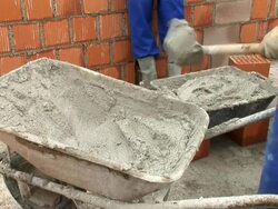 HD: Wheelbarrow With Mortar Stock Footage