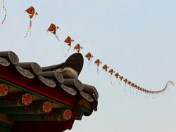 MS Roof Tile and Kite flying against sky / Yongin, Gyeonggido, South Korea Stock Footage