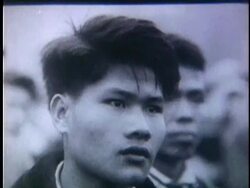 1950s B/W MONTAGE Faces of Vietnamese men and women in crowd / Vietnam Stock Footage