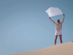 Woman with scarf in desert Stock Footage