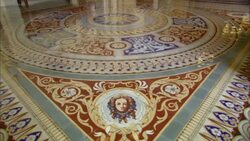 Light reflects off a shiny tiled floor near a depiction of a woman. Stock Footage