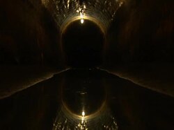 Sewage reflects the lights in a sewage tunnel in New York City. Stock Footage