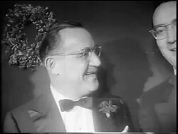 B/W 1955 close up Benny Goodman talking with Steve Allen at premiere of "The Benny Goodman Story" / newsreel Stock Footage