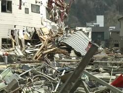 Destruction in Kesennuma City, a traditional fishing town in N E Japan filmed on 1 April 2011, 3 weeks after a tsunami which was caused by magnitude 9 Tohoku earthquake off north east Japan / AUDIO Stock Footage