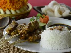 CU Shot of Chicken sate, fried chicken skewer with steamed rice, balinese food dish  at Asia / Ubud, Bali, Indonesia Stock Footage