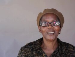 African woman looking at the camera, smiling. Stock Footage