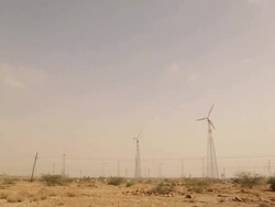 Wind turbine on desert, Jaisalmer, Rajasthan, India Stock Footage