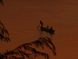WS HA Silhouetted fishermen on Mekong River at sunset / Luang Prabang, Laos Stock Footage