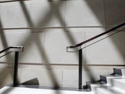 MS Young man running down with tablet device in hand on  stairs / Minneapolis, Minnesota, United States Stock Footage
