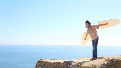 Boy learns to fly with wings Stock Footage