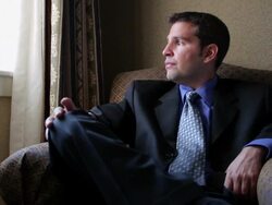 MS Man sitting chair typing on mobile device / Portland, ME, United States Stock Footage