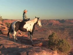 MS ZO Women with Horses over looking spectaculair Red Rock Canyons, Majestic Western Landscapes at sunset / Telluride, Colorado, United States  Stock Footage